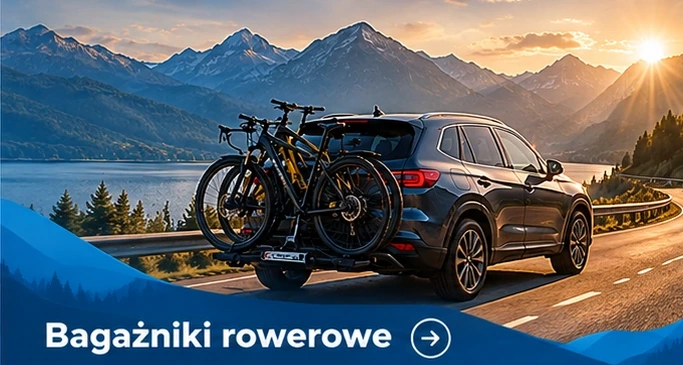 Bagażniki rowerowe — granatowe auto na górskiej drodze z odpowiednim wyposażeniem