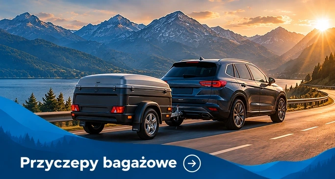 Przyczepy bagażowe — granatowe kombi z przyczepą na drodze nad jeziorem