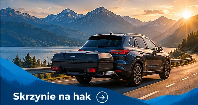 Skrzynie na hak — granatowe auto na górskiej drodze z odpowiednim wyposażeniem